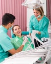 Portrait of dentist and patient at dental clinic