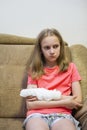 Portrait of Depressed Caucasian Blond Girl with Injured Hand In Plaster Royalty Free Stock Photo