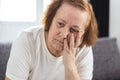 Portrait of depressed elderly woman having worries