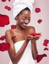 Portrait, dermatology and black woman with red petals, cosmetics and luxury on a white studio background. Face, African Royalty Free Stock Photo