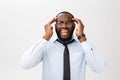 Portrait of desperate annoyed black male screaming in rage and anger tearing his hair out while feeling furious and mad Royalty Free Stock Photo