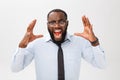 Portrait of desperate annoyed black male screaming in rage and anger tearing his hair out while feeling furious and mad Royalty Free Stock Photo