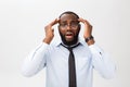 Portrait of desperate annoyed black male screaming in rage and anger tearing his hair out while feeling furious and mad Royalty Free Stock Photo