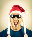 Portrait of a desperate young man with Santa Claus red hat Royalty Free Stock Photo