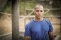 Portrait of determined man standing during obstacle course