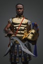 African warrior from ancient greece against grey background