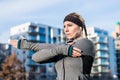 Portrait of a determined young woman stretching her left arm dur