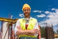 Portrait of a determined young worker looking at camera with con