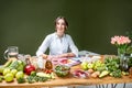 Portrait of the dietitian with healthy food in the office