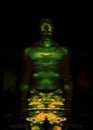 Portrait, digital collage and special processing. Muscular weird guy in briefs. Darkness. Glow. Green.