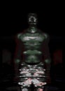 Portrait, digital collage and special processing. Muscular weird guy in briefs. Darkness. Glow. Green, gray.