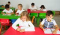 Diligent pupils studying in classroom