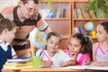 Portrait of diligent schoolkids and their teacher Royalty Free Stock Photo