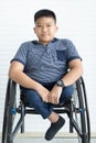 Portrait of disable kid boy on wheelchair with firmly eyes and happy smile face