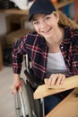 Portrait disabled female carpenter in workplace