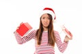 Portrait of a disappointed asian girl in christmas hat Royalty Free Stock Photo