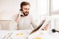 Portrait of a disappointed man talking on mobile phone Royalty Free Stock Photo