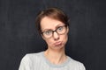 Portrait of discontented and funny young woman pouting lips Royalty Free Stock Photo