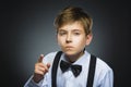 Portrait of displeased angry boy with threatens finger isolated on gray background. Closeup Royalty Free Stock Photo