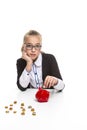 Portrait of Displeased Caucasian Teenager Girl in Dark Jacket Putting Coin Into The Piggybank For Savings Royalty Free Stock Photo