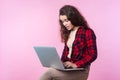 Portrait of displeased teenage girl worried about laptop problems, software failure, looking desperate and helpless. pink Royalty Free Stock Photo