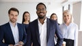 Portrait of diverse colleagues posing together in office Royalty Free Stock Photo