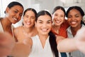 Portrait of a diverse group of five happy businesswomen taking a selfie together at work. Cheerful businesspeople taking