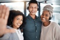 Portrait of a diverse group of happy smiling call centre telemarketing agents taking selfies together in an office Royalty Free Stock Photo