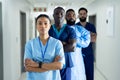 Portrait of diverse group of healthcare workers standing in line in hospital corridor Royalty Free Stock Photo