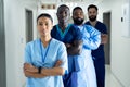 Portrait of diverse group of healthcare workers standing in line in hospital corridor Royalty Free Stock Photo