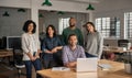 Diverse team of smiling designers working together in an office