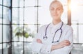 Confident female doctor posing in her office Royalty Free Stock Photo