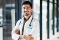 Portrait, doctor arms crossed and man smile for medical services, GP clinic support or professional medicare help Royalty Free Stock Photo