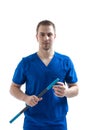 Portrait of doctor. The doctor holds in his hands and demonstrates a special medical wand for massage. Isolate on a white