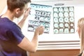 Portrait of doctor examining radiogram picture. Smiling physician pleased with results of treatment. Medicine and health care