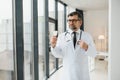 Portrait of doctor holding box of pills. Royalty Free Stock Photo