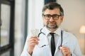 Portrait of doctor holding box of pills. Royalty Free Stock Photo