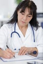 Portrait doctor holding clipboard Royalty Free Stock Photo