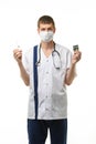 Portrait of a doctor holding a syringe with medicine in one hand and pills in the other hand, isolated on white background Royalty Free Stock Photo