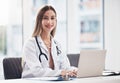 Portrait, doctor and laptop with a woman at work in a hospital for healthcare, consulting or trust. Medical, research Royalty Free Stock Photo