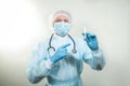 Portrait of a doctor man in a medical mask. There is a stethoscope on the doctor`s neck. During a pandemic, remedies are essentia