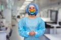Portrait of a doctor in a mask, on which a rainbow is drawn as a sign of hope of victory over a coronovirus infection