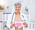 Portrait, doctor and mature woman with intestine model in hospital clinic. Face, gastroenterology and medical Royalty Free Stock Photo