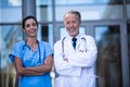 Portrait of doctor and nurse standing with arms crossed Royalty Free Stock Photo