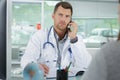 portrait doctor phoning patient Royalty Free Stock Photo