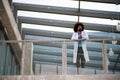 Portrait of doctor standing in hospital, leaning on glass railing, looking at camera. Royalty Free Stock Photo