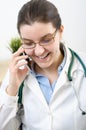 Portrait of a doctor talking on smartphone Royalty Free Stock Photo