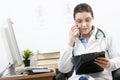 Portrait of a doctor talking on smartphone Royalty Free Stock Photo