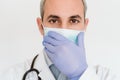 Portrait of doctor wearing protective mask and gloves indoors. Corona virus concept Royalty Free Stock Photo