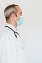 Portrait of doctor wearing protective mask and gloves indoors. Corona virus concept Royalty Free Stock Photo